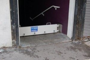 A doorway with a flood barrier on the side of it.