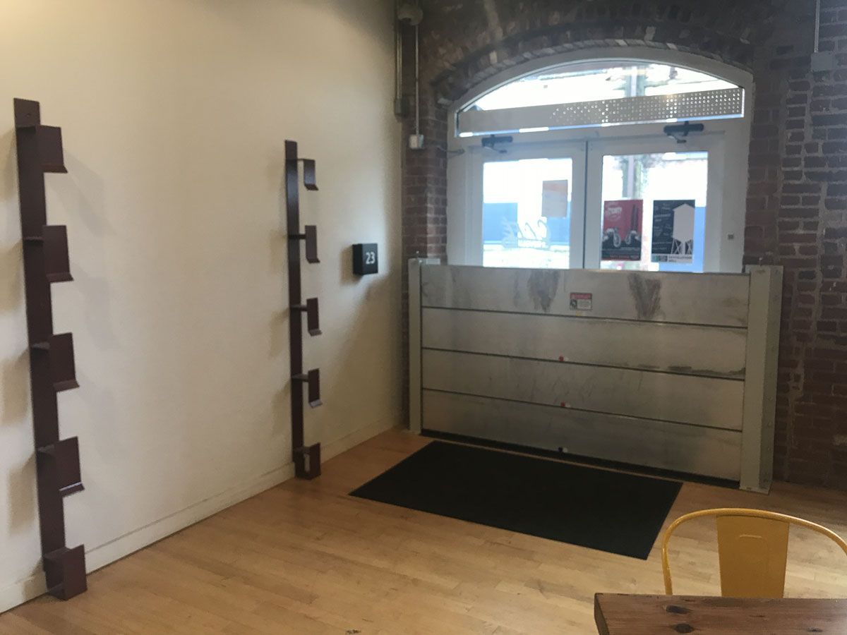 A room with a table and chairs and a door