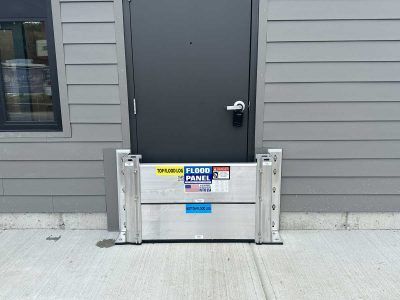 A door with a flood barrier on the side of it.