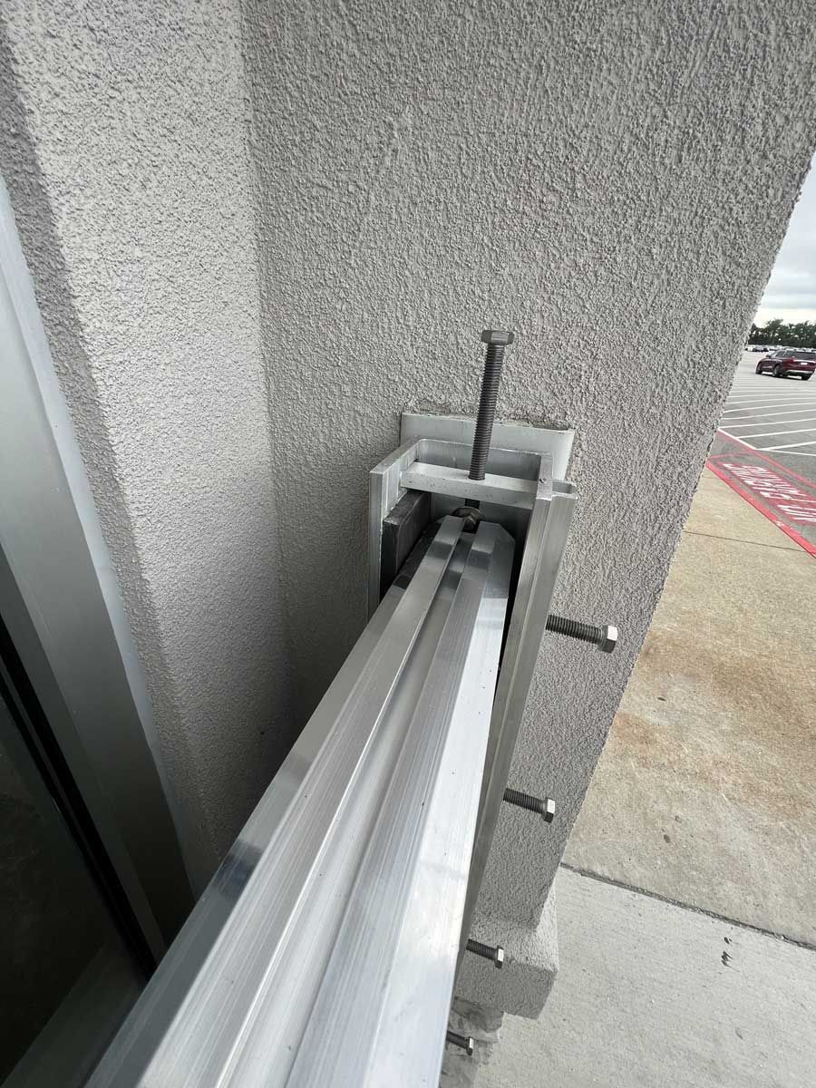 A close up of a sliding glass door on a building.
