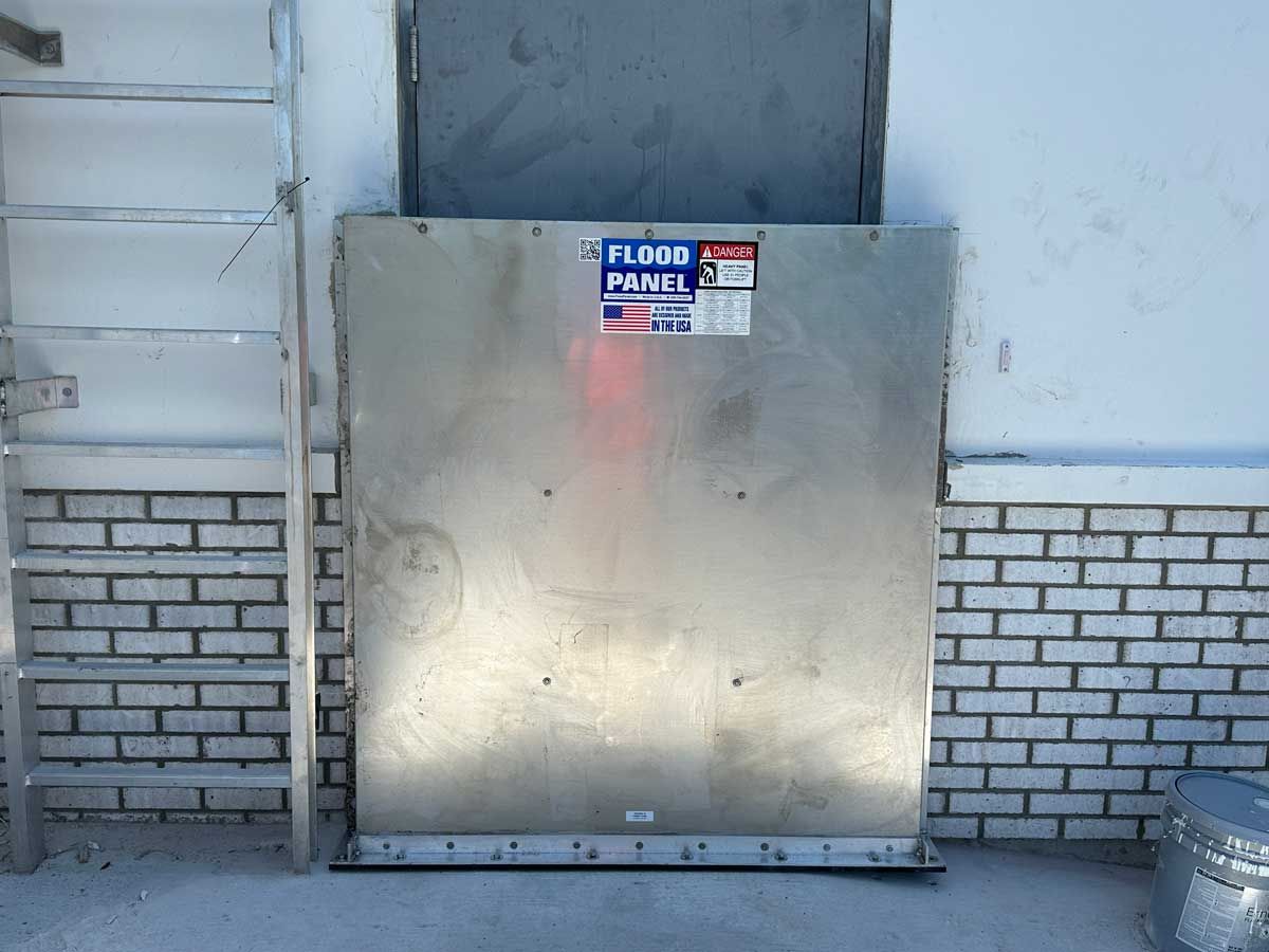 A metal box with a label that says ' flood a panel ' on it