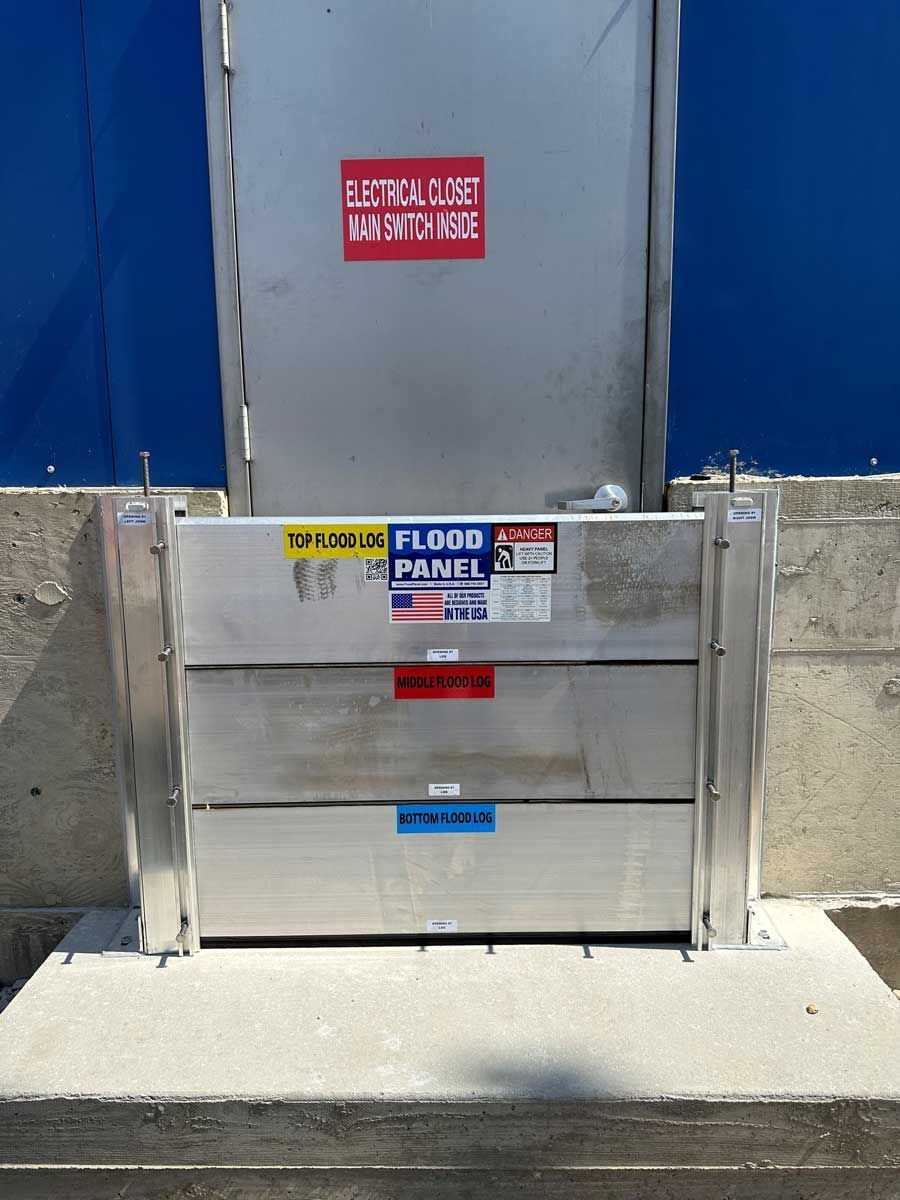 A flood panel is sitting in front of a blue wall
