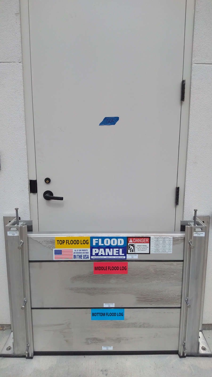 A door with a flood panel attached to it
