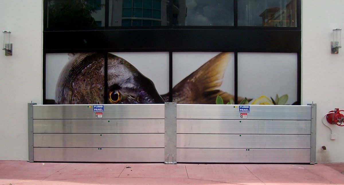 A flood barrier with a picture of a dog on it