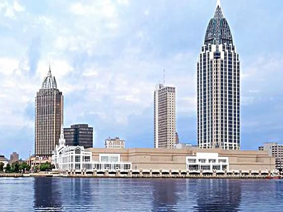 A city skyline with a large body of water in the foreground.