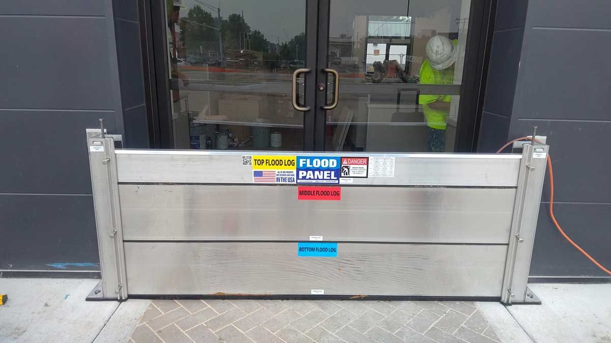 A flood barrier is sitting in front of a building.