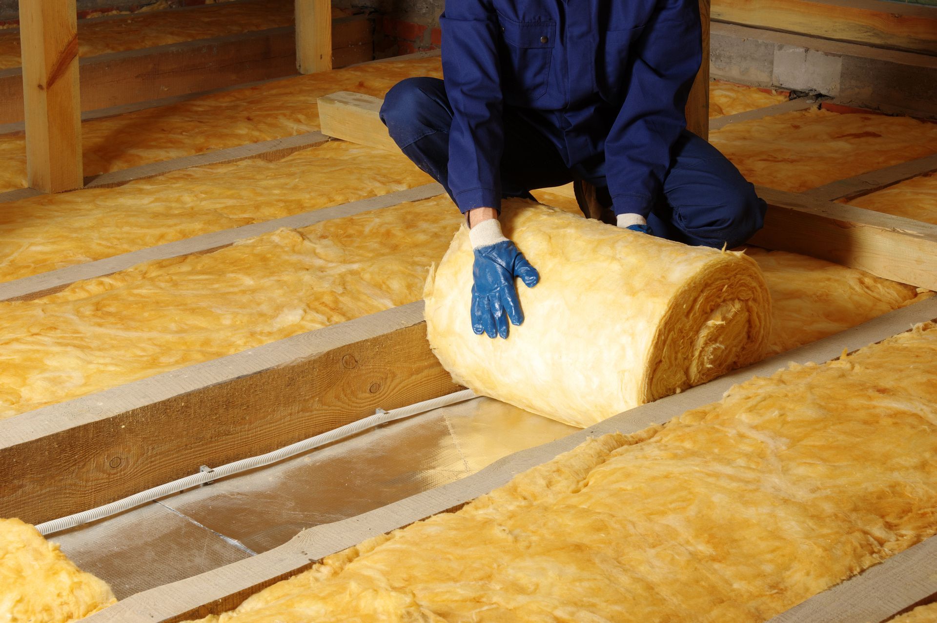 Chunks of yellow and green foam filling a white bag.