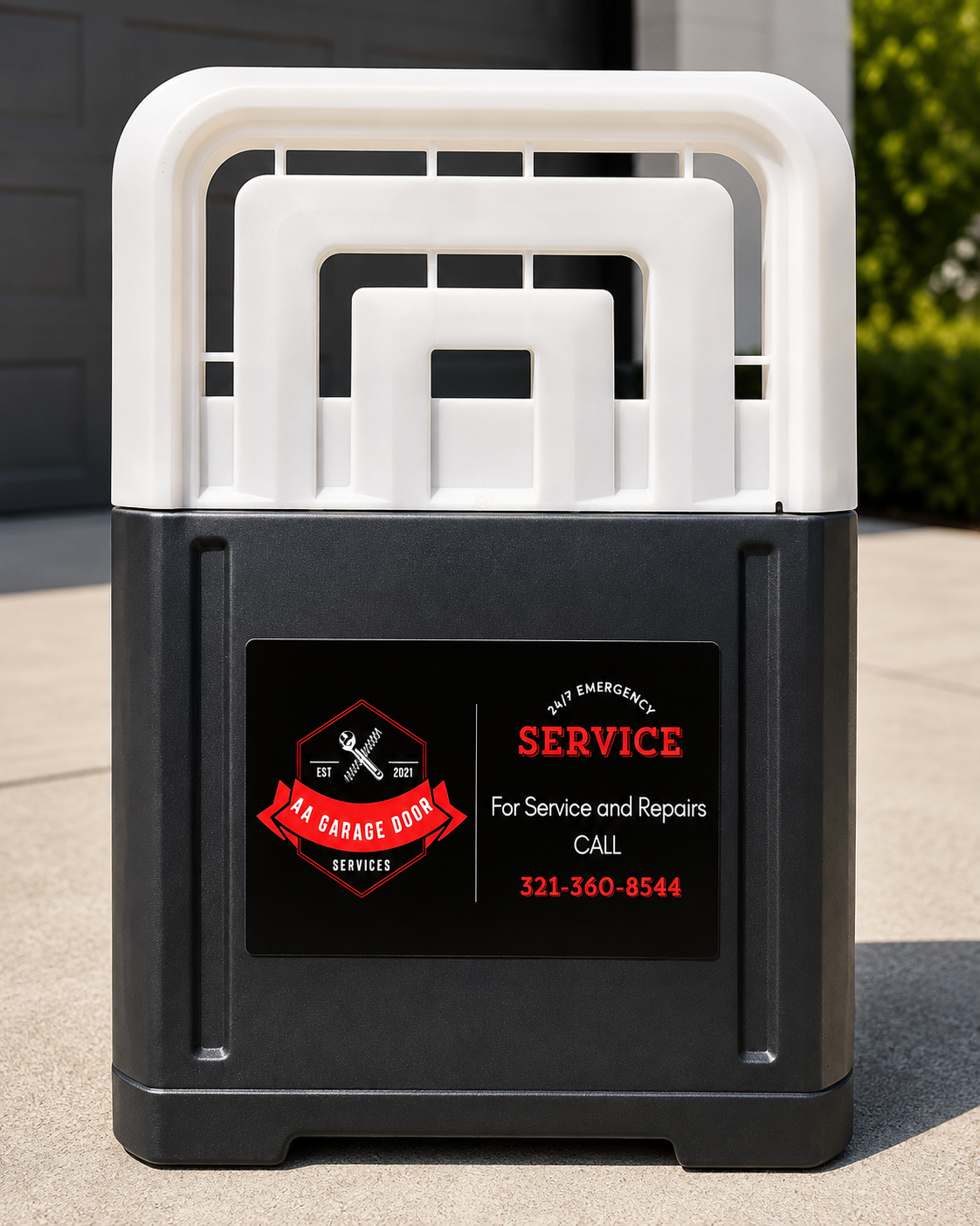 Black-and-white portable plastic step stool with a service sticker on the front outdoors