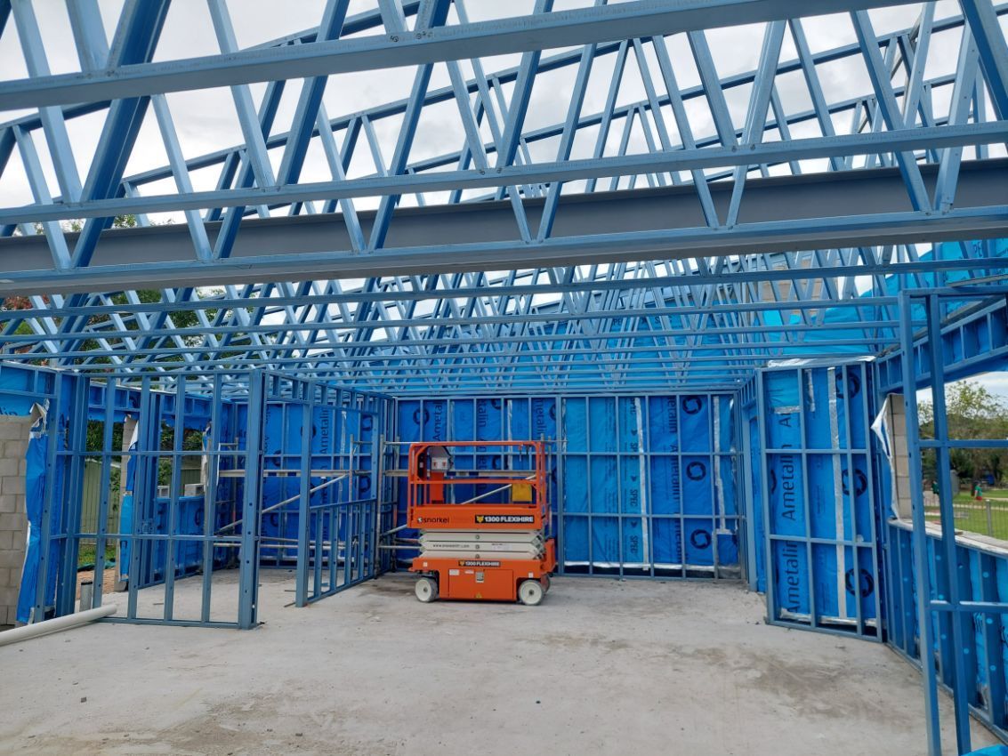 Workers on Roof of Commercial Building Under Construction — Commercial Builder in Townsville, QLD