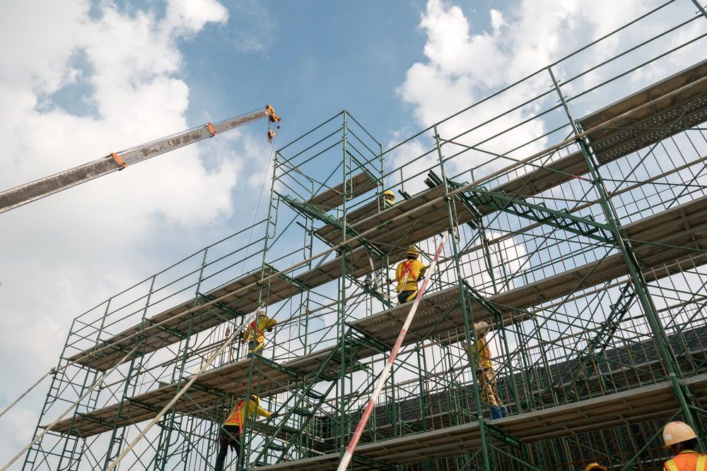 Workers Installing Steel Columns at Construction Site — Construction Company in Townsville, QLD