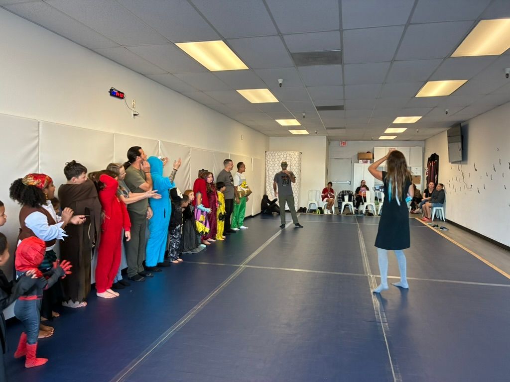 Children in colorful costumes during our halloween party.
