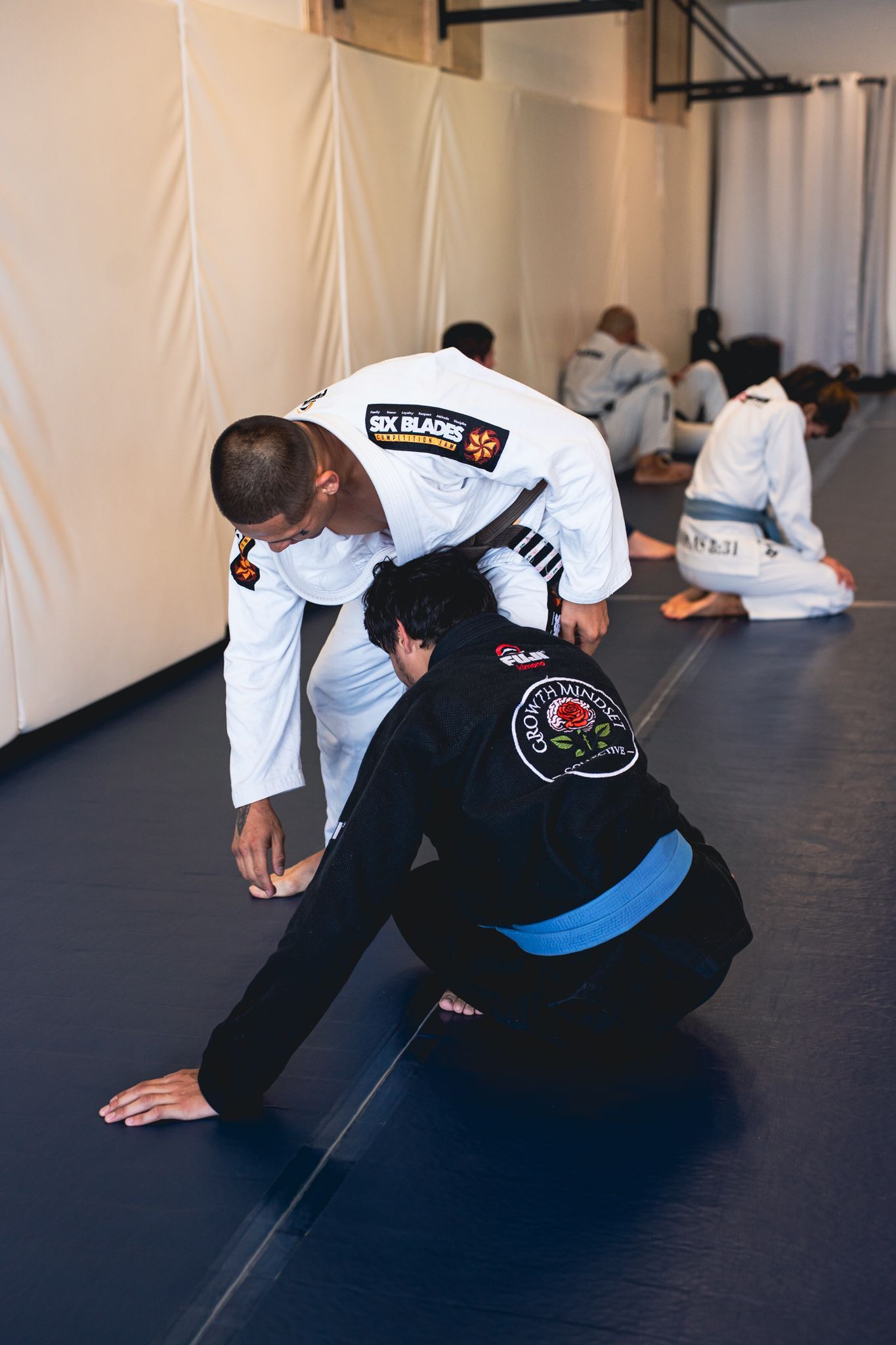Coach Mark Miller instructing students on technique at Growth Mindset Collective