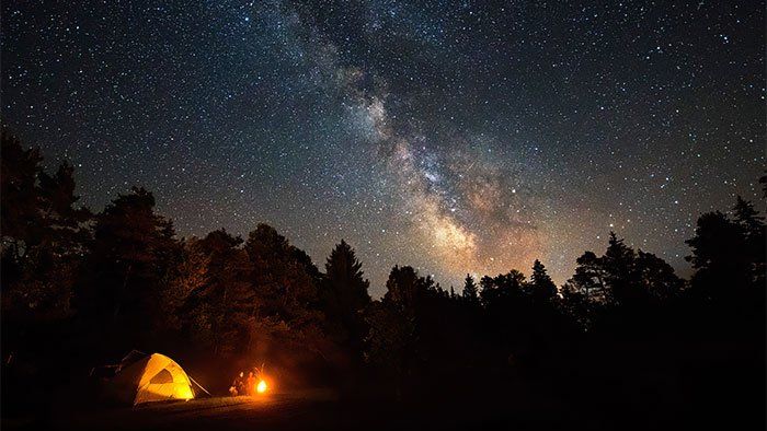 milky way over campsite