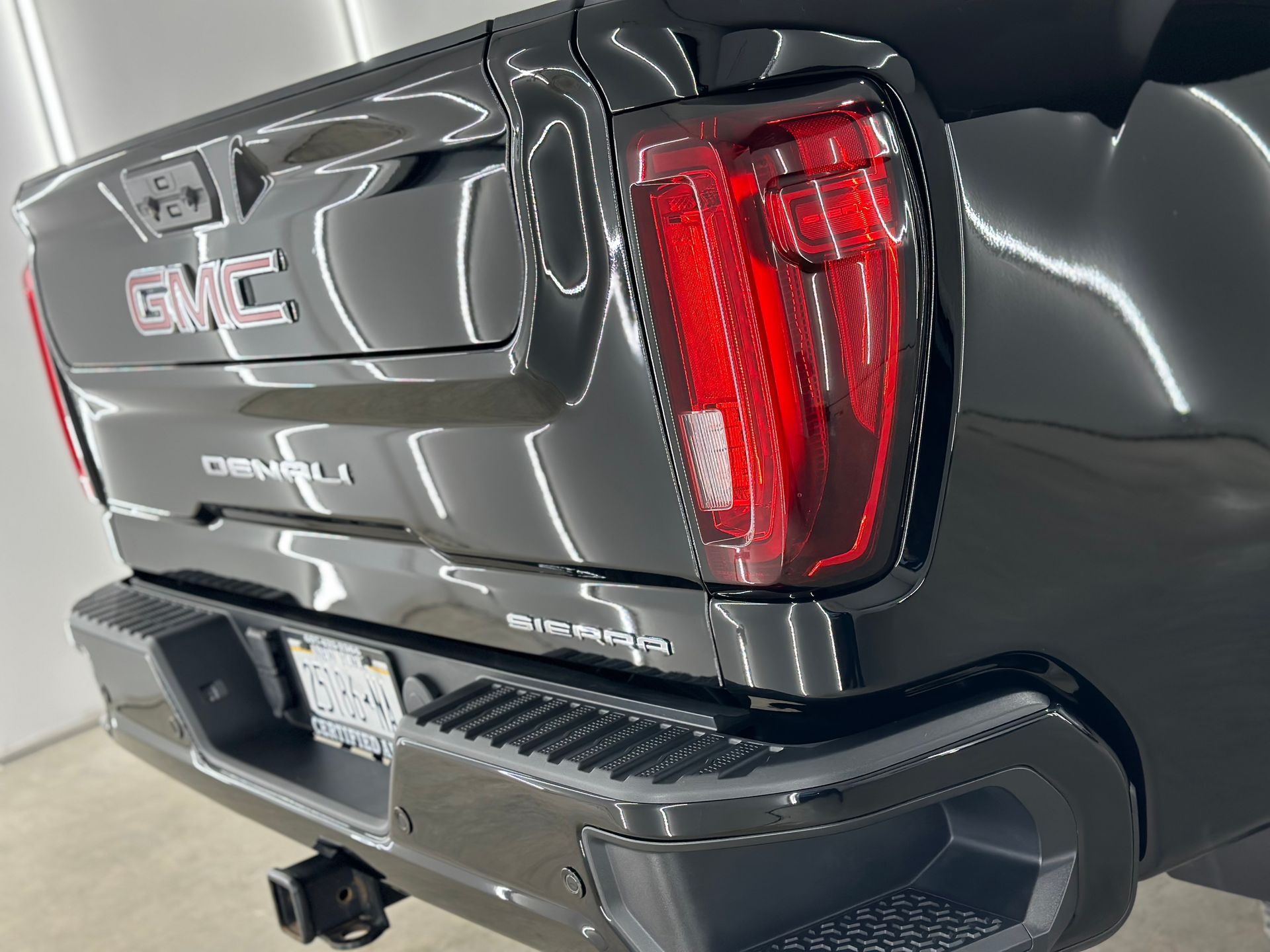 gleaming black bmw suv front quarter panel