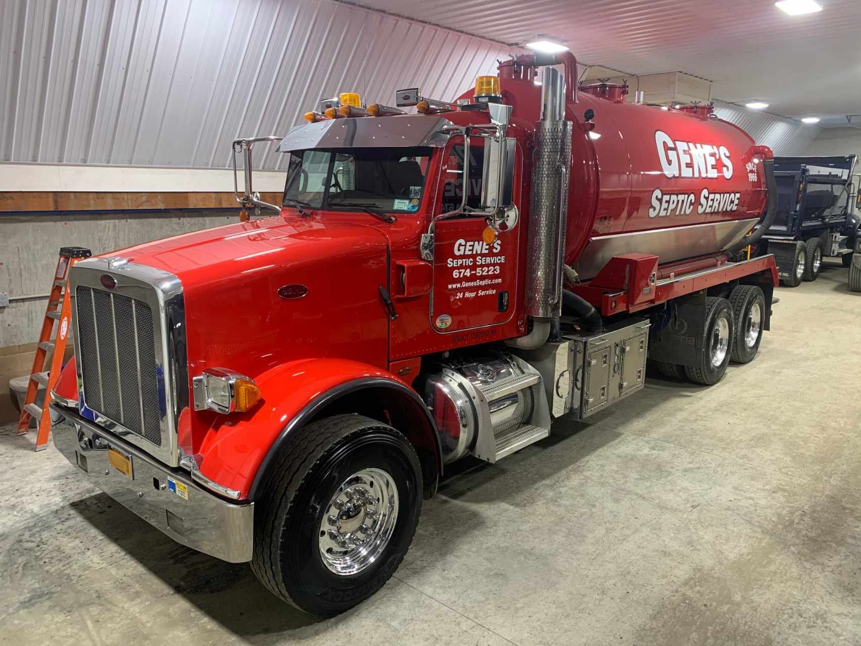 freshly detailed red vac truck
