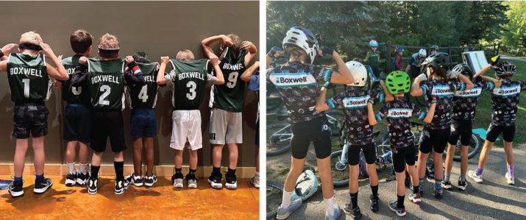 a group of young boys are standing next to each other holding their jerseys .