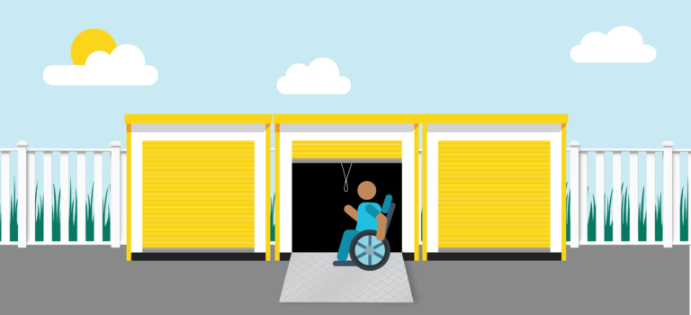 a man in a wheelchair is getting out of a storage door .