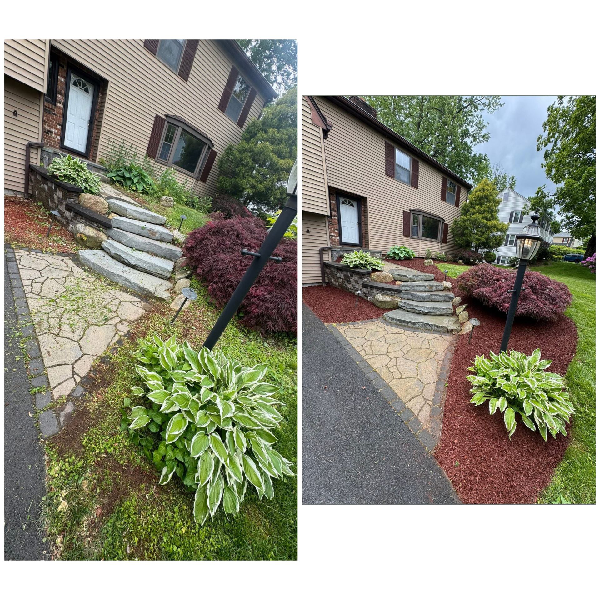 Front yard landscaping with stone steps, mulch beds, green plants, and a brick house exterior