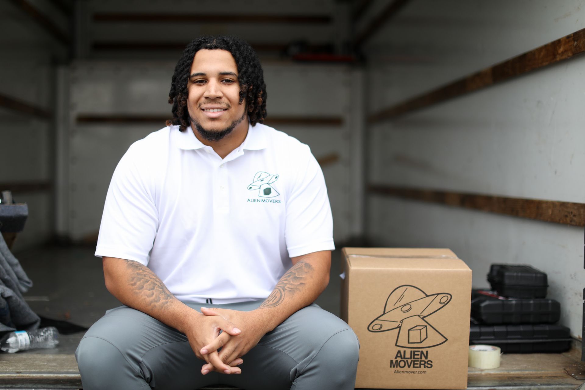 Alien Movers team efficiently loading a truck with furniture and boxes, showcasing their reliable moving services in Philadelphia.