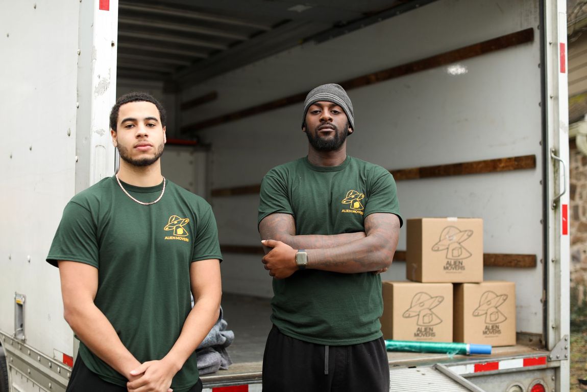 Diligent Alien Movers team members in Philadelphia disassembling office furniture with care and precision, ensuring a smooth and organized corporate relocation process.