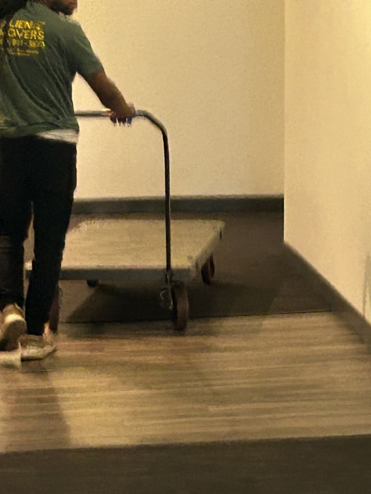 A professional mover from Alien Movers in Philadelphia maneuvers a dolly to assist with an efficient move.