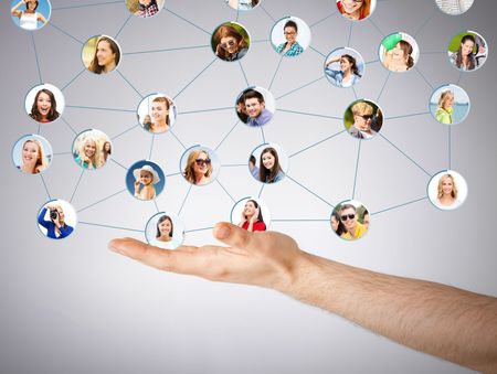 Hand holding connected profile icons in a social network diagram