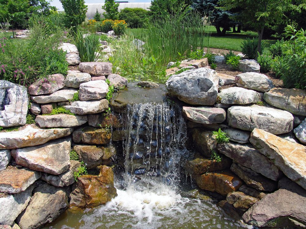 Stone Garden Waterfall With Water — On The Mark Landscaping in Branyan, QLD