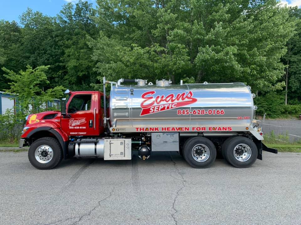 Red Truck on Road — Mahopac, NY — Evans Septic Tank Service