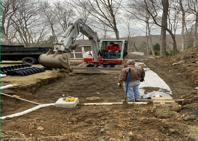 Worker Installing Septic Tank — Mahopac, NY — Evans Septic Tank Service