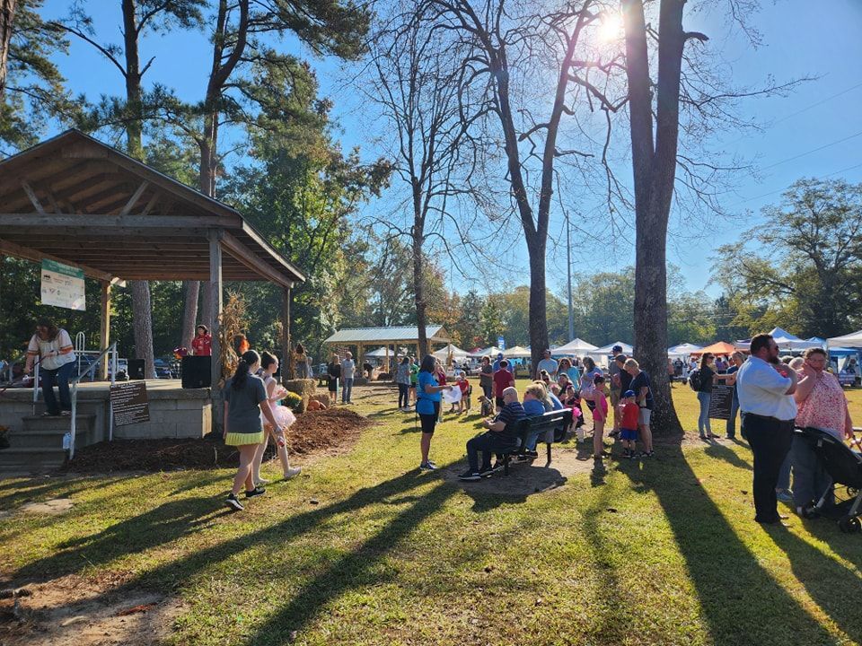 Spring Bunny Shop Hop vendor fair with colorful booths and families