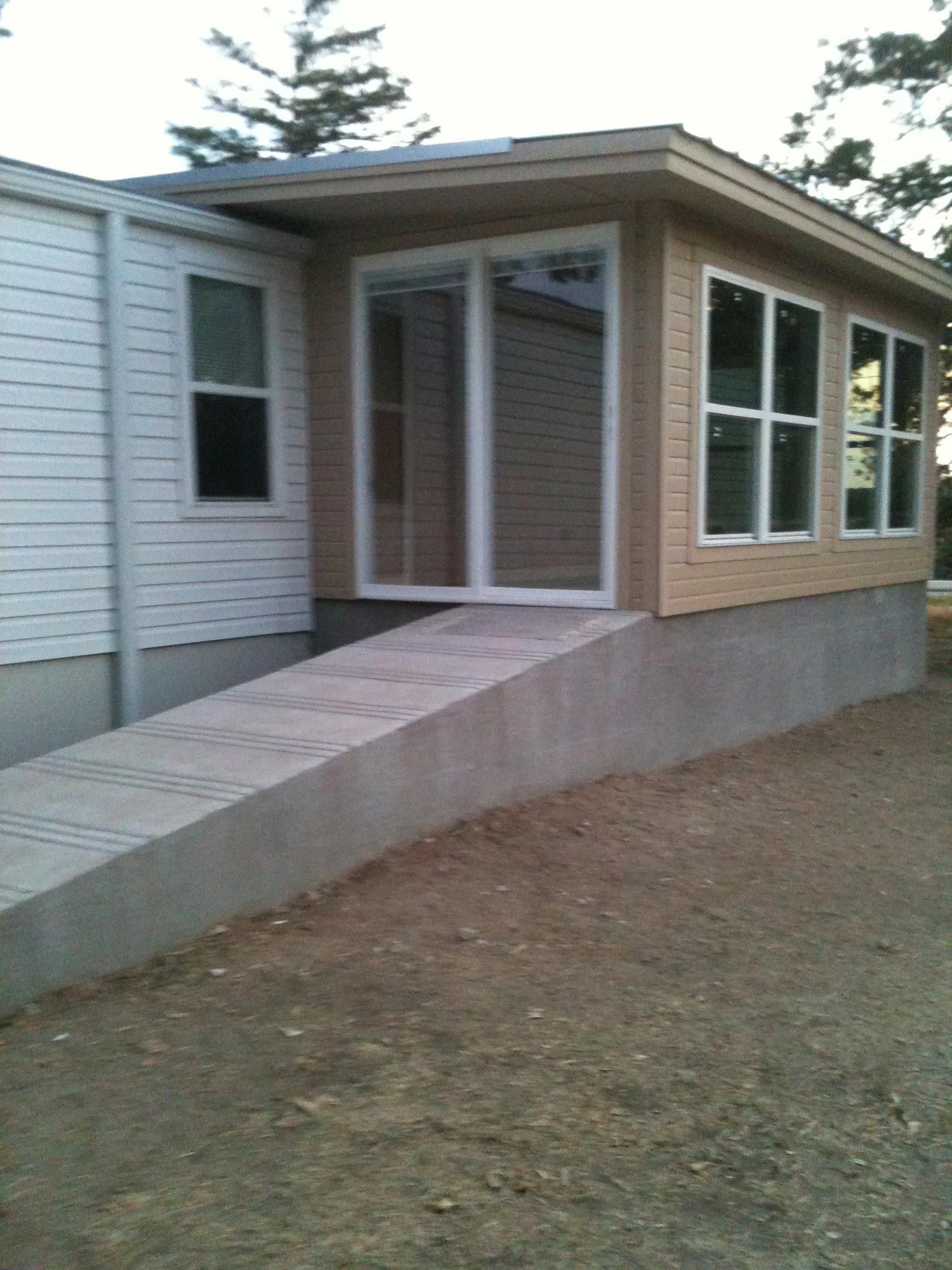 A small house with a ramp leading to it