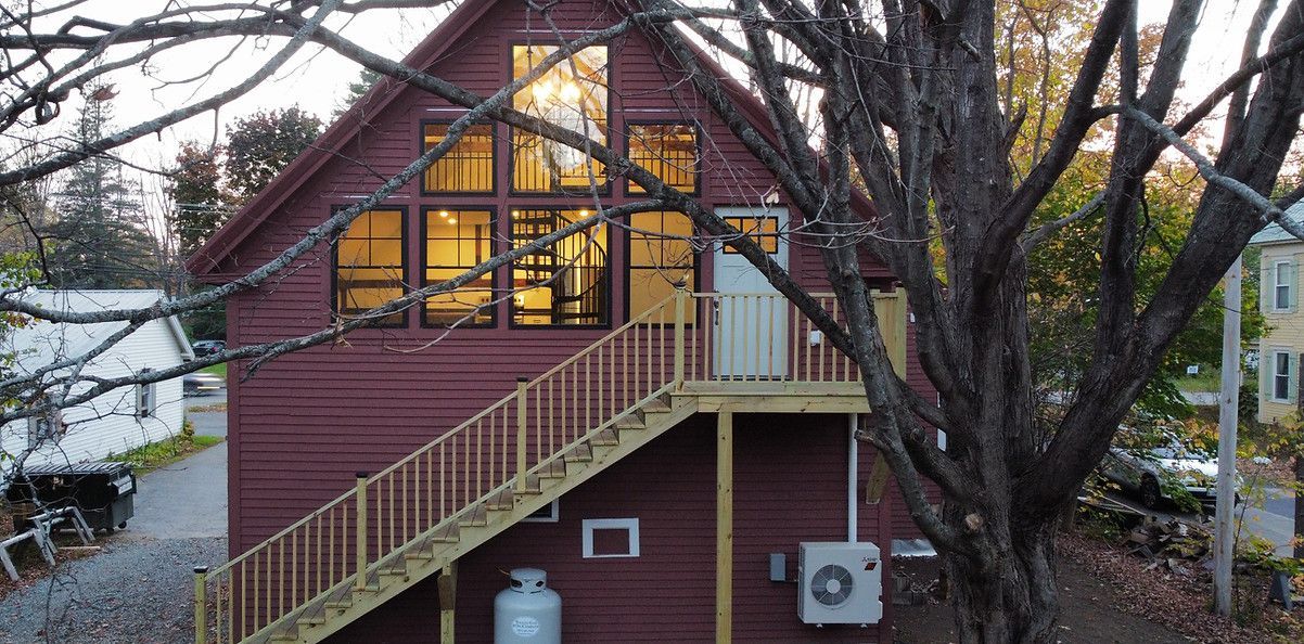 An aerial view of a house with stairs leading up to the second floor.