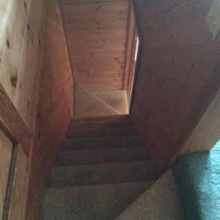 A set of stairs leading up to the second floor of a house.