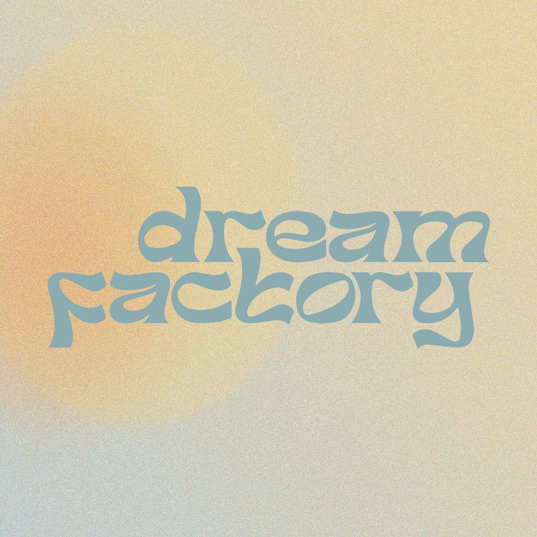 Light blue “dream factory” text on a warm beige, grainy background with a pale yellow glow.