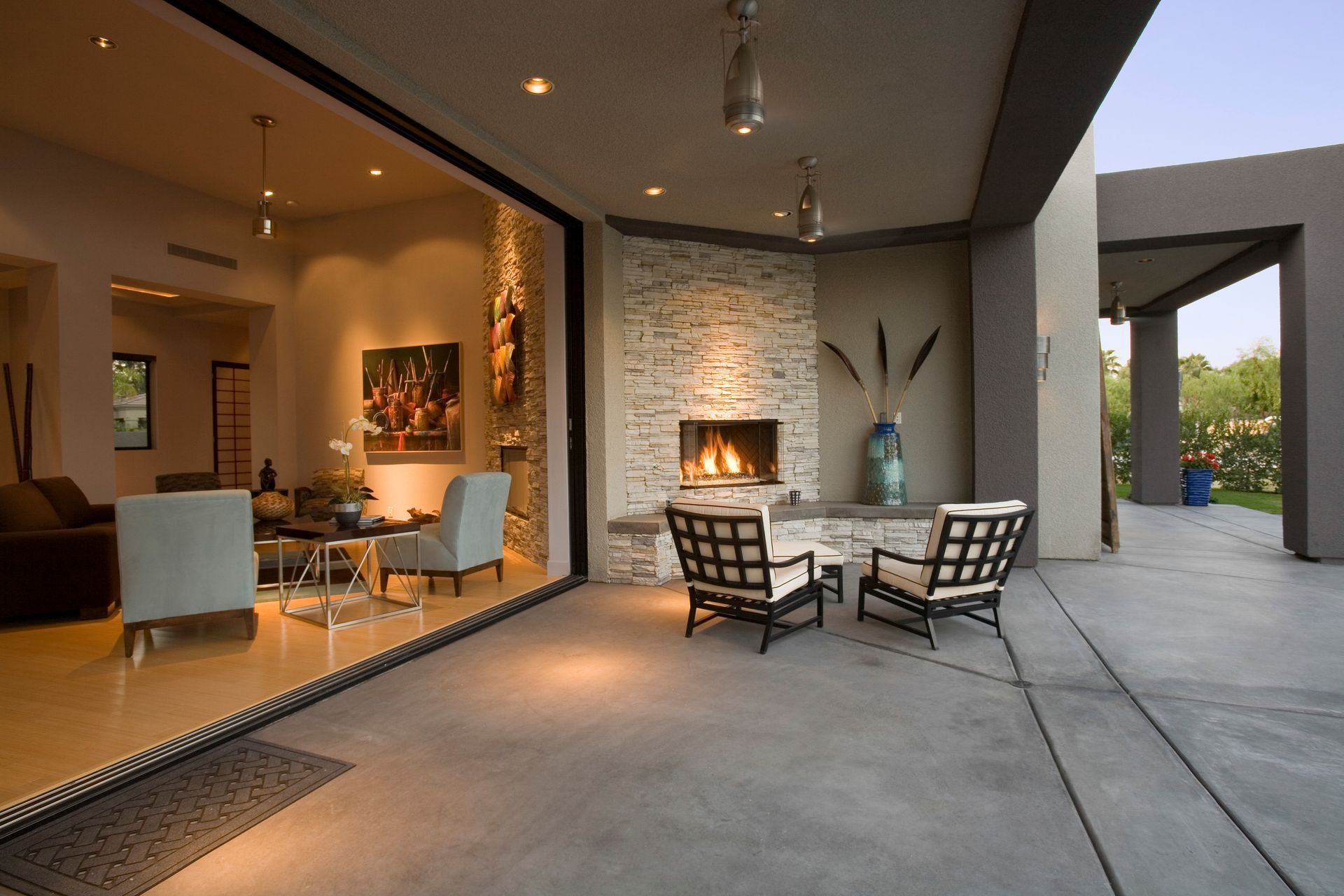 Modern patio with lounge chairs and garden views showcasing outdoor living makeover design. Modern patio with lounge chairs and garden views showcasing outdoor living makeover design.