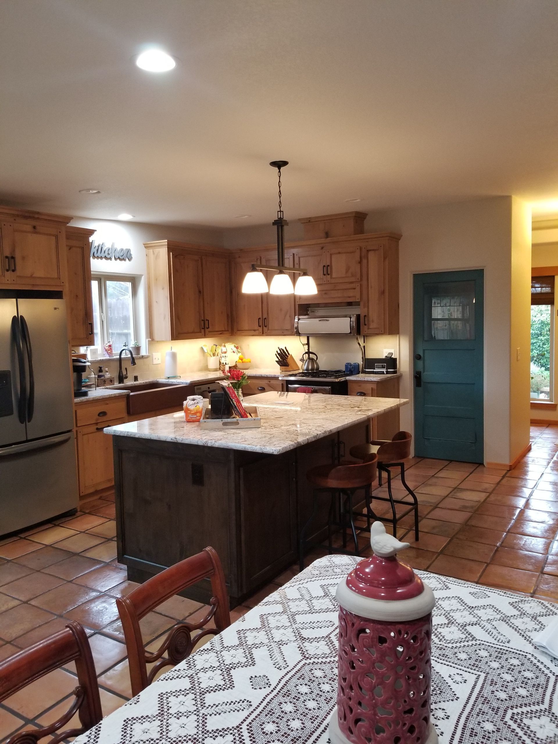 A kitchen with a large island in the middle of it