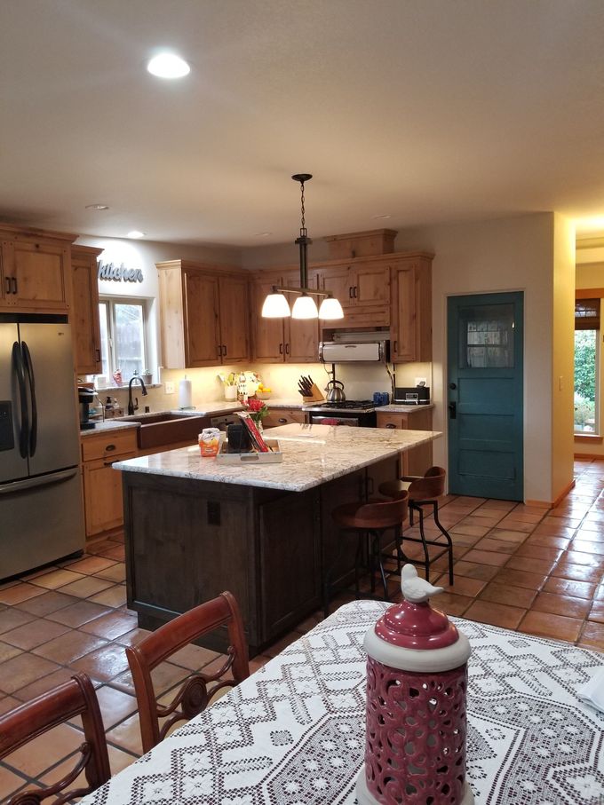 A kitchen with a large island in the middle of it