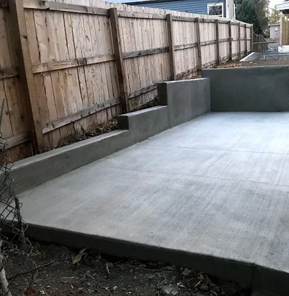 Rough stone wall made of irregular tan, gray, and beige bricks