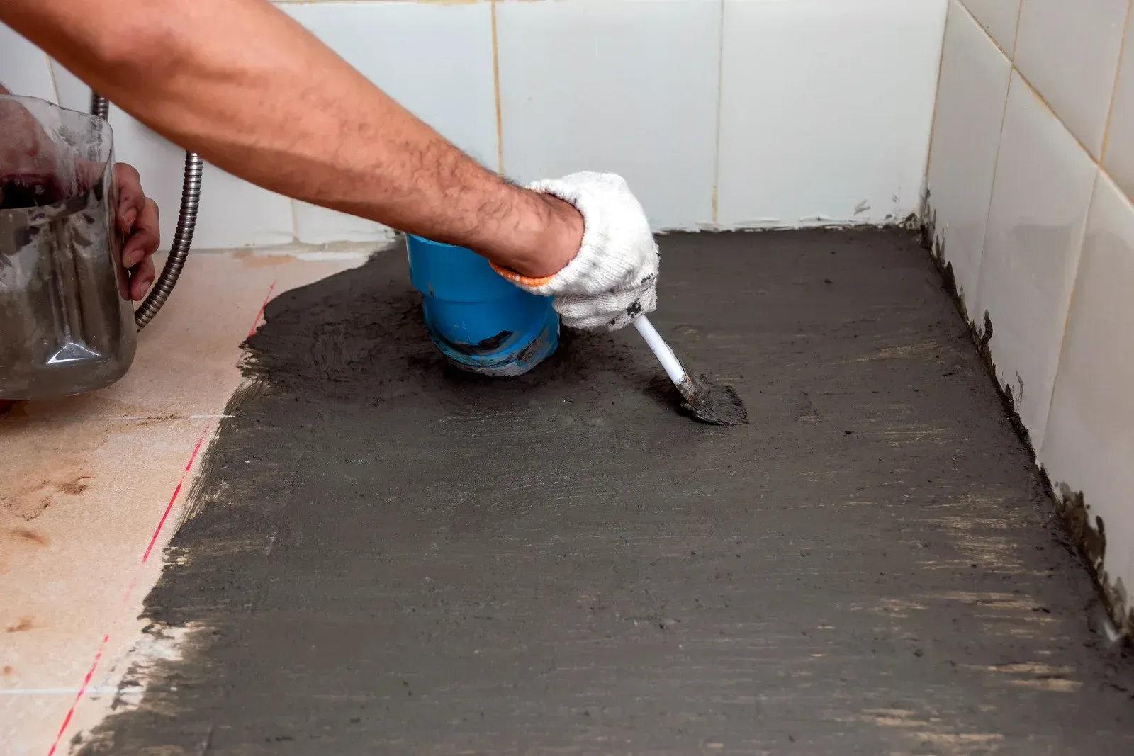 Blue and white painted flat rooftop with a building and cityscape in the background.