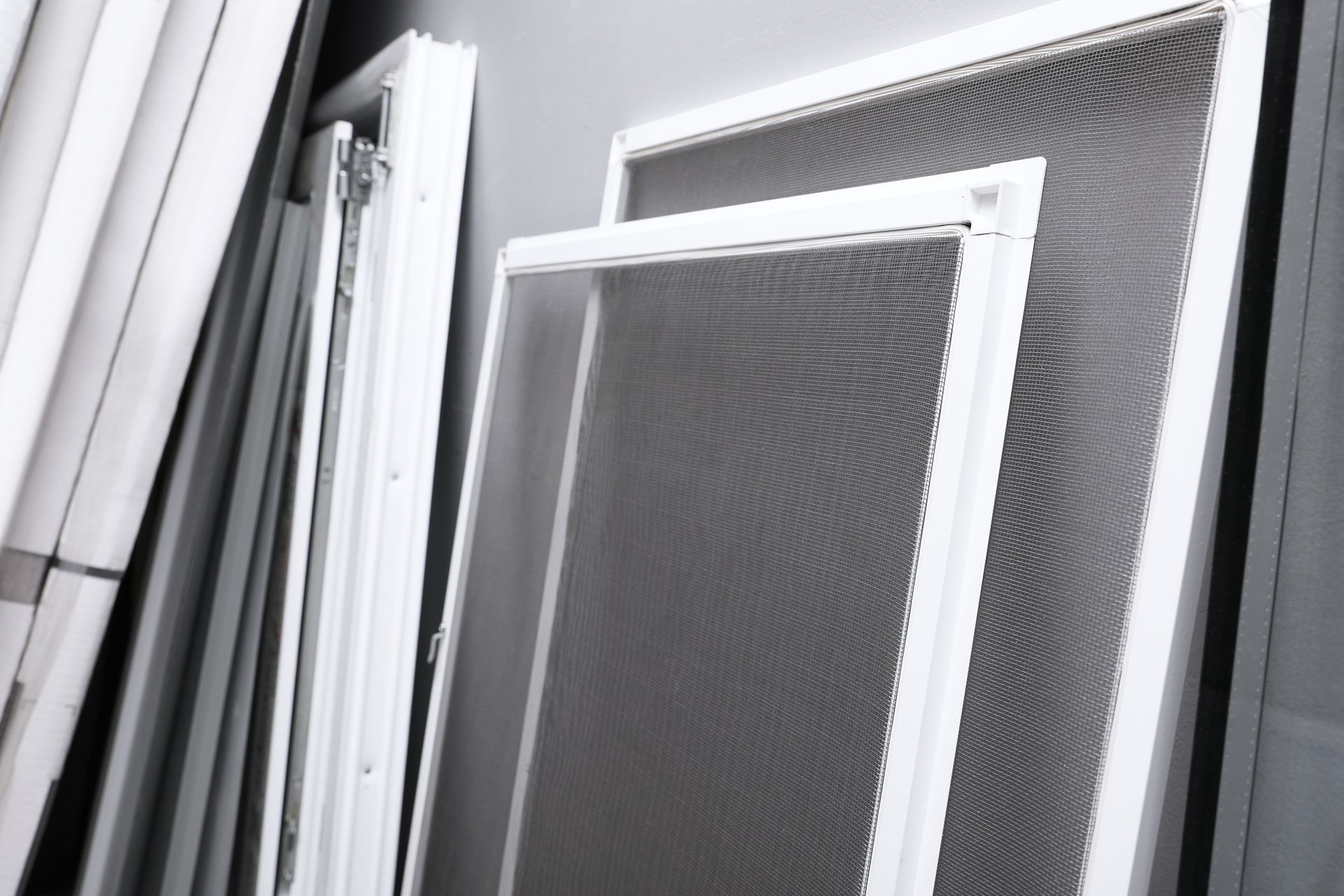 window screens near grey wall window screens near grey wall