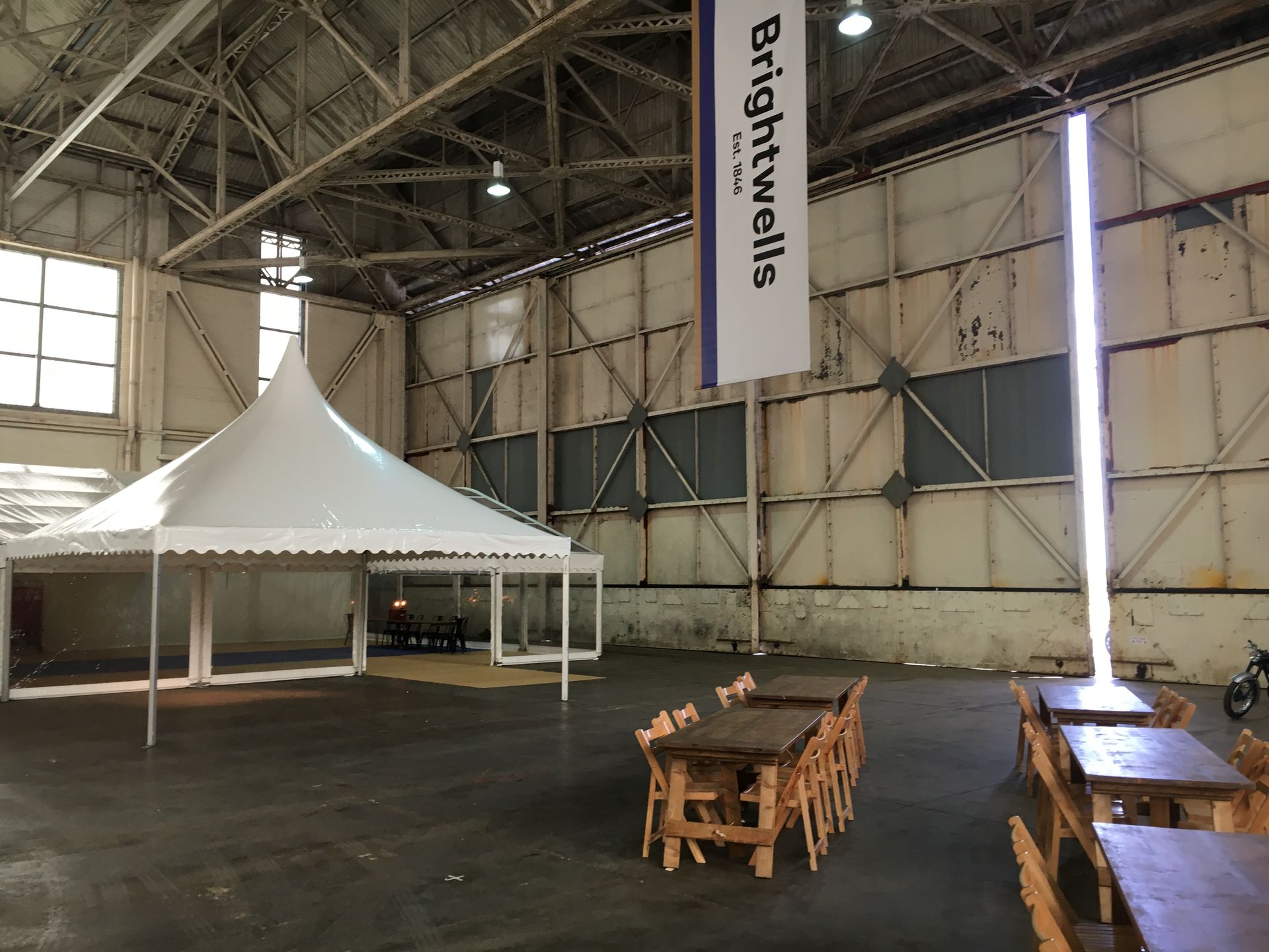 An empty warehouse with a marquee hire on a TV set