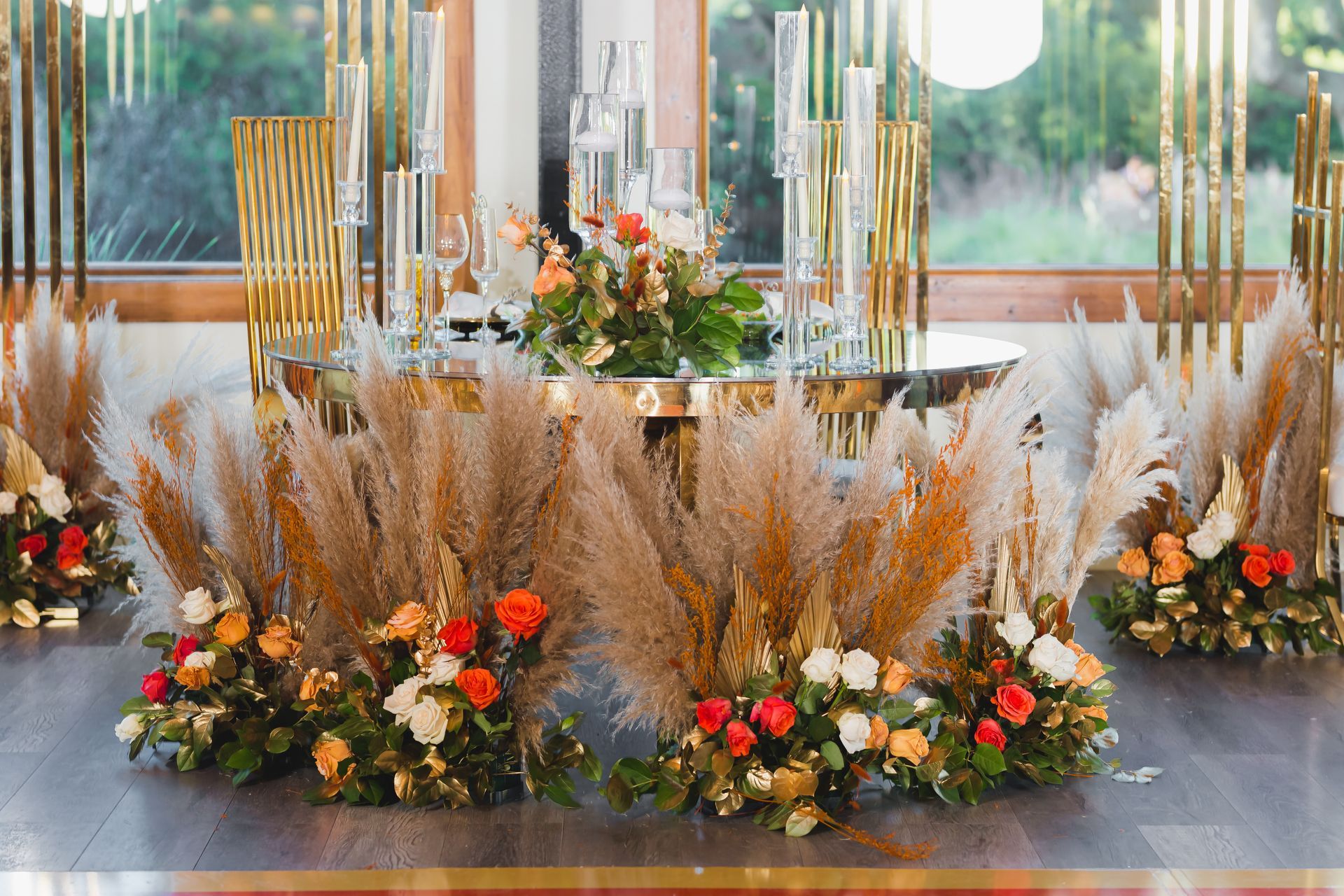 Elegant floral arrangement with tall pampas grass and colorful flowers in a bright indoor setting