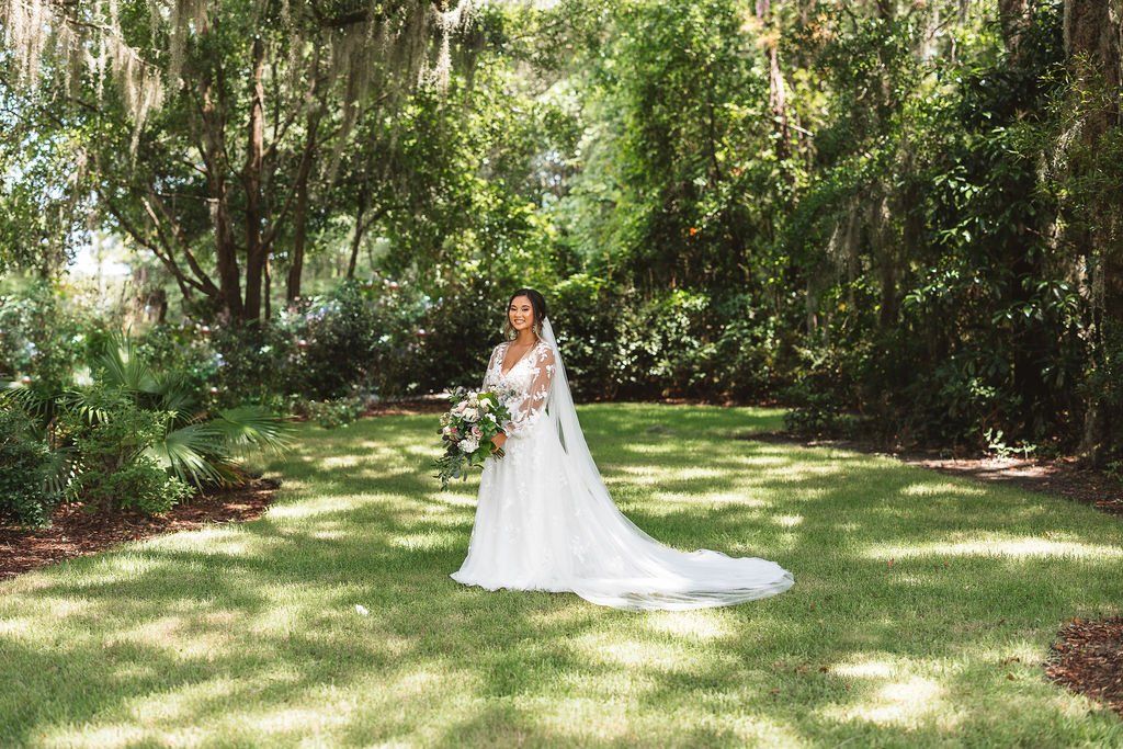 Bride by trees Hart Meadows Ranch