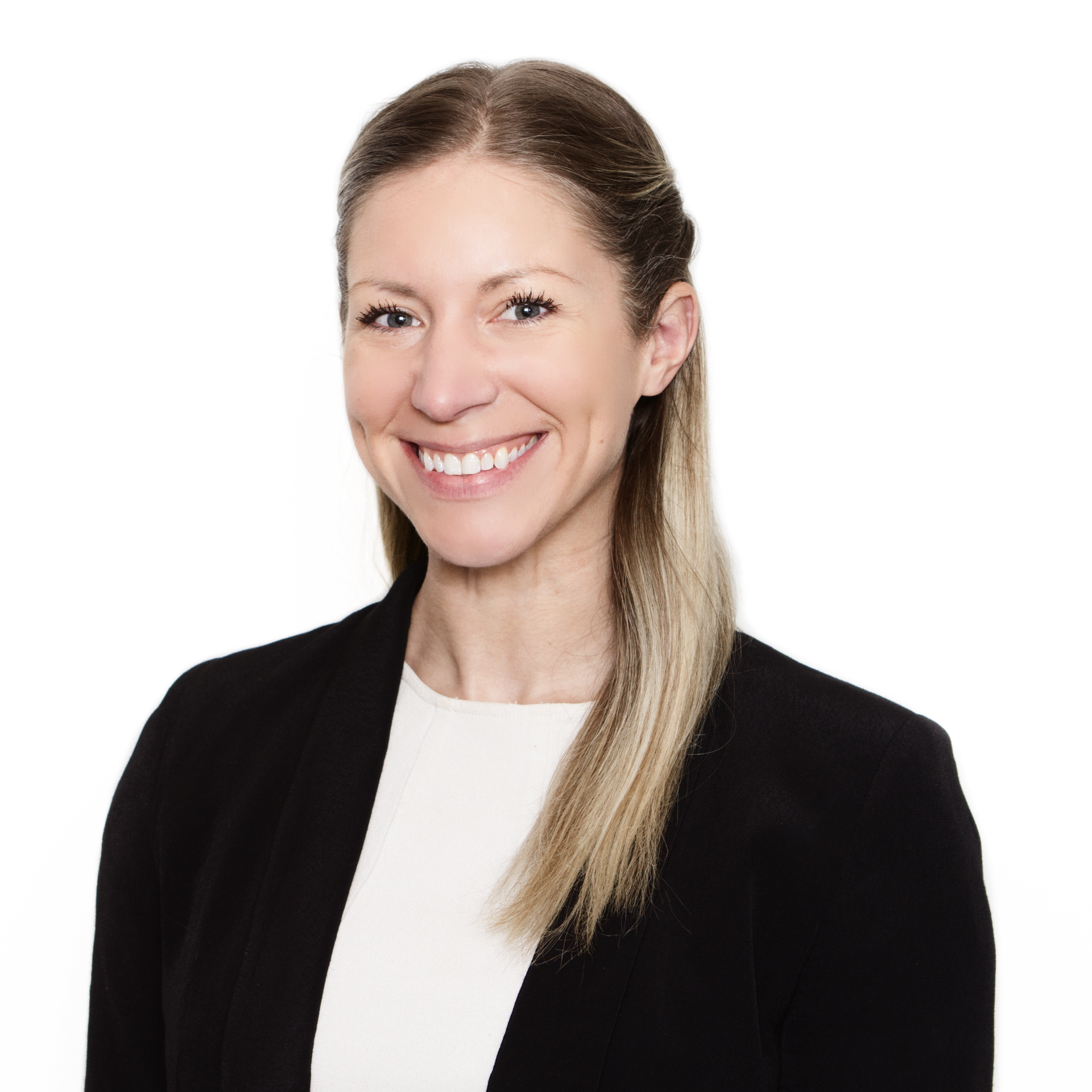 Smiling person with blond hair in a black blazer against a white background