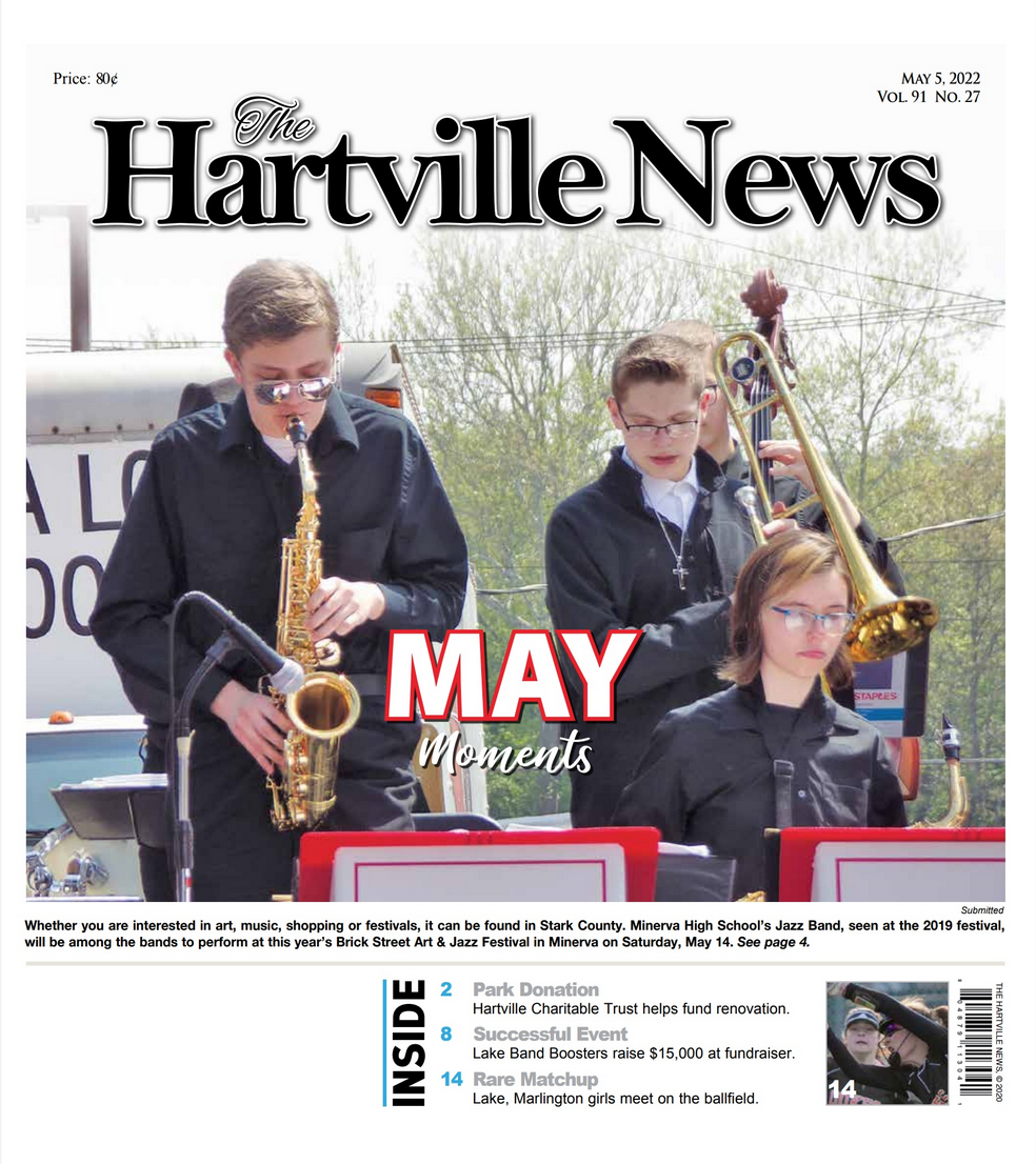 The Hartville News front page features students playing instruments in a band outdoors under the headline 