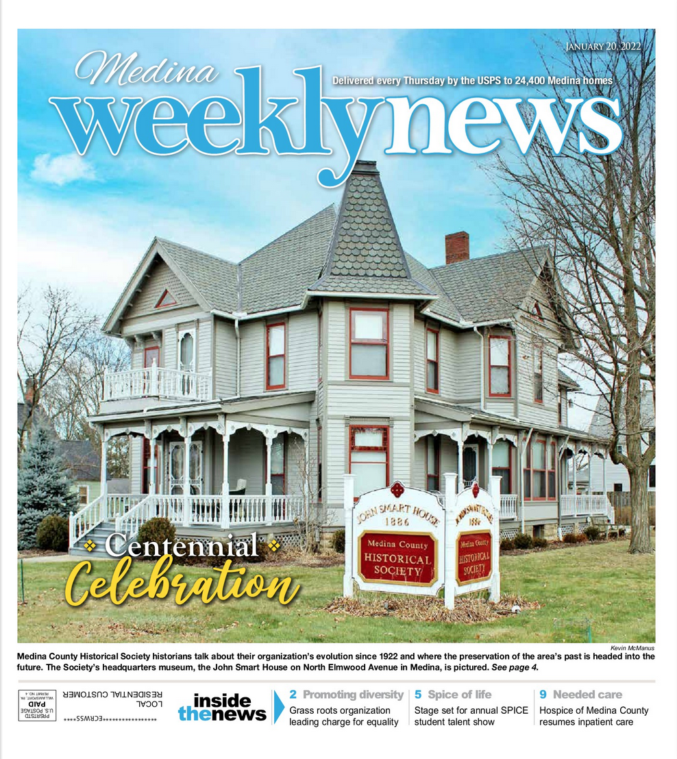 A front page of the Medina Weekly News featuring a Victorian house and a sign marking the site's centennial celebration.