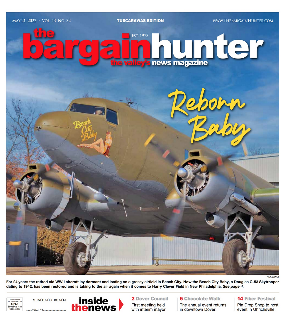 A vintage military plane painted olive green with 
