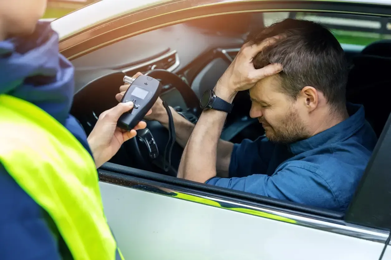 Driver undergoing a police breathalyzer test in Ontario after suspected impaired driving