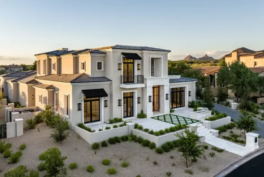 Large white luxury home in Arizona desert setting