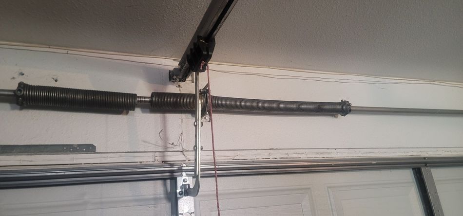 Broken garage door torsion spring